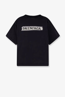 Back view of balenciaga womens used effect cotton black t shirt with white distressed tape style logo across back