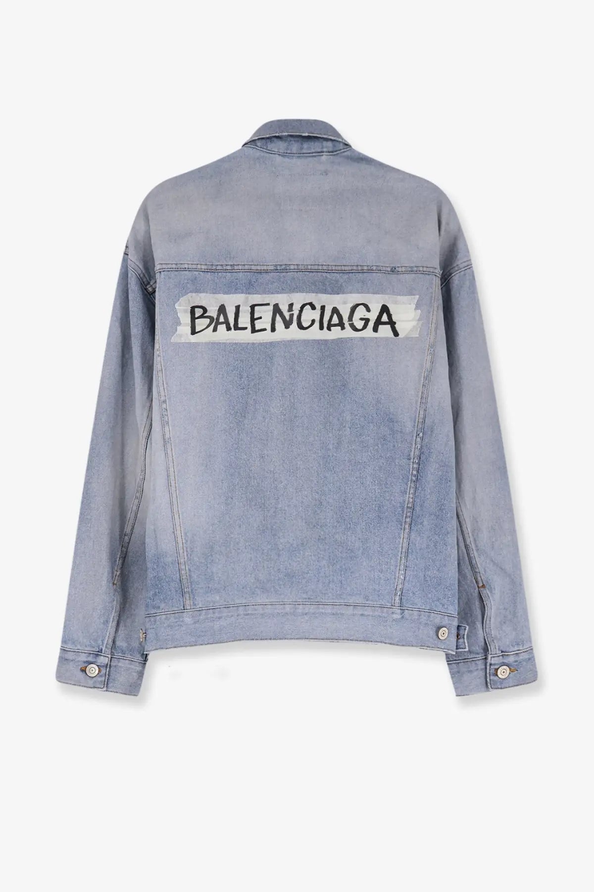 Back of balenciaga women’s washed out light-wash denim jacket with bold black logo and white tape detailing