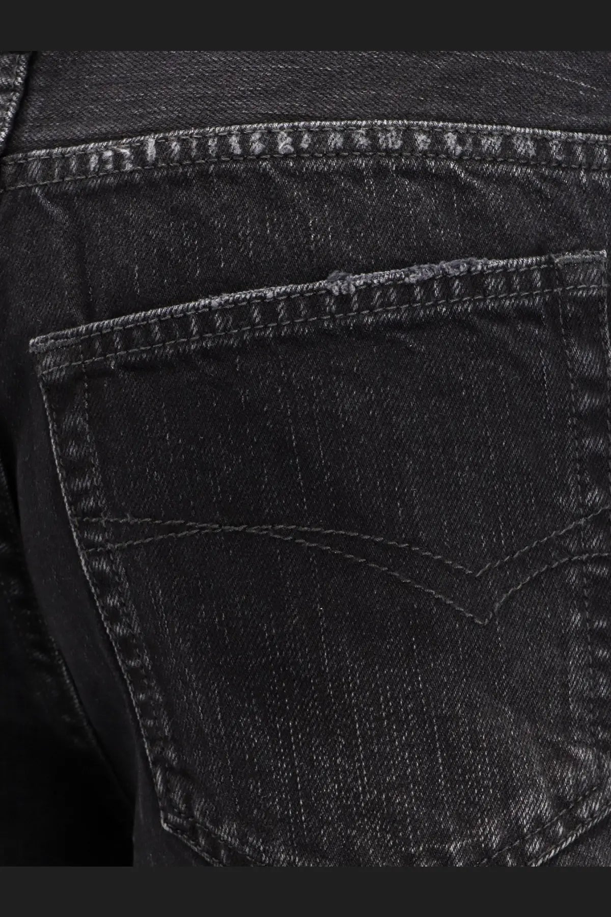 Back view of balenciaga women’s wide leg black denim trousers with classic pocket stitching and subtle faded texture
