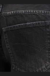 Back view of balenciaga women’s wide leg black denim trousers with classic pocket stitching and subtle faded texture