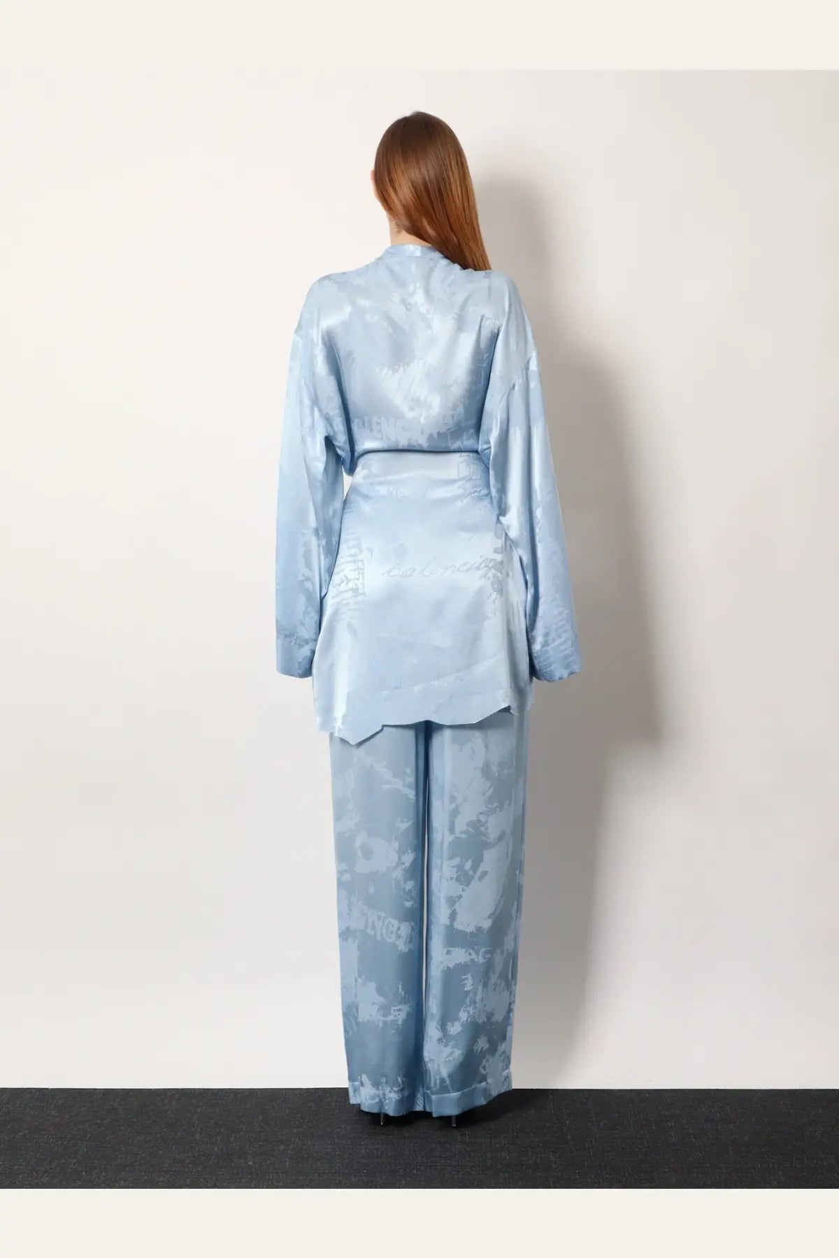 Balenciaga women’s wrap silk mini dress in light blue satin with subtle abstract pattern