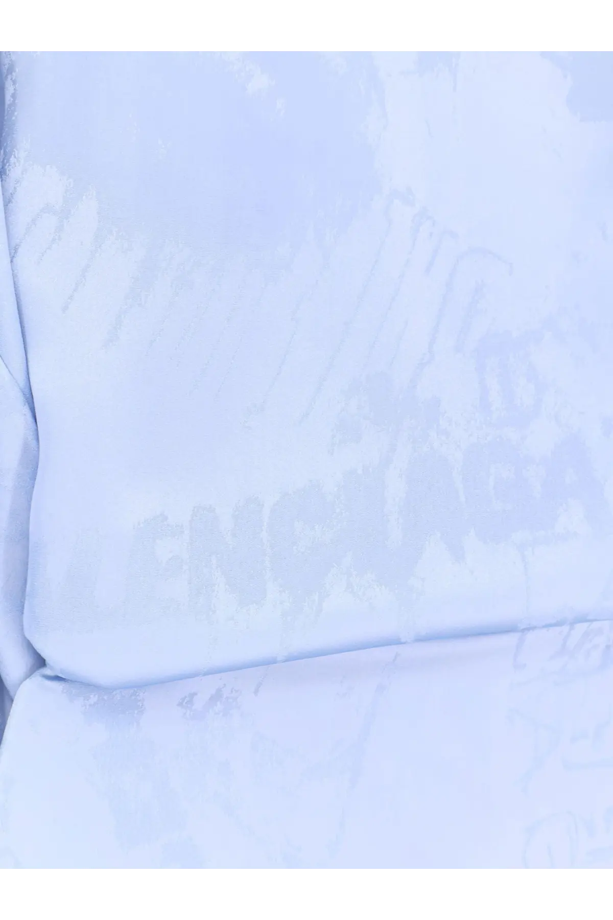 Balenciaga women’s wrap silk mini dress in light blue textured fabric with faint faded lettering across the surface