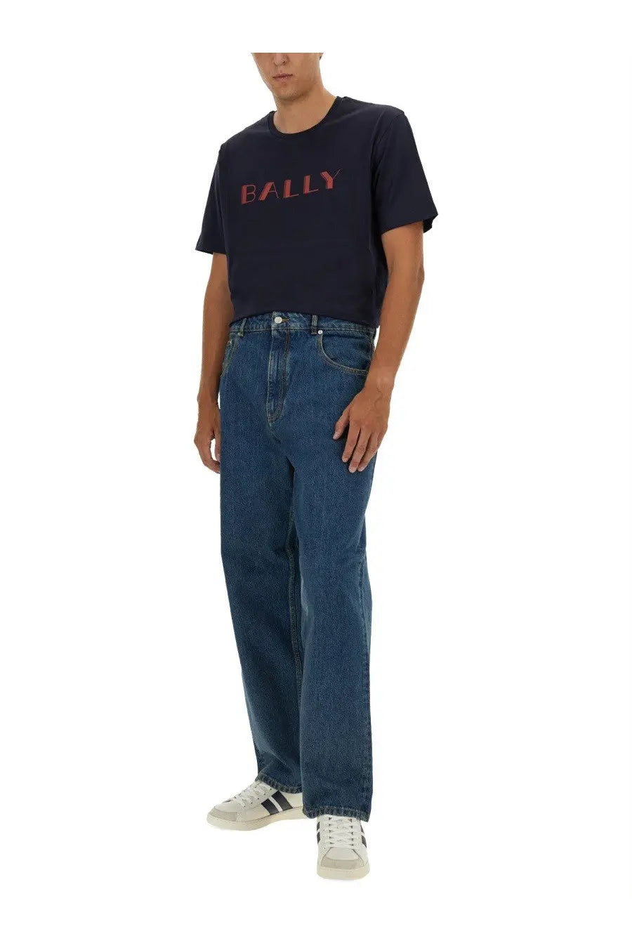Navy blue bally t-shirt with red logo paired with bally men’s baggy fit blue jeans for casual wear