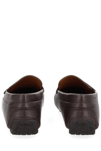 Brown leather loafers with textured surface and black rubber soles from bally men’s moccasin driver pilot brown