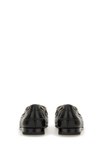 Bally men’s moccasin pathy black patent leather loafers with gold-tone metal accents front view