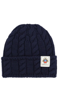 Navy blue cable-knit wool beanie with folded brim and white Bally logo patch for men