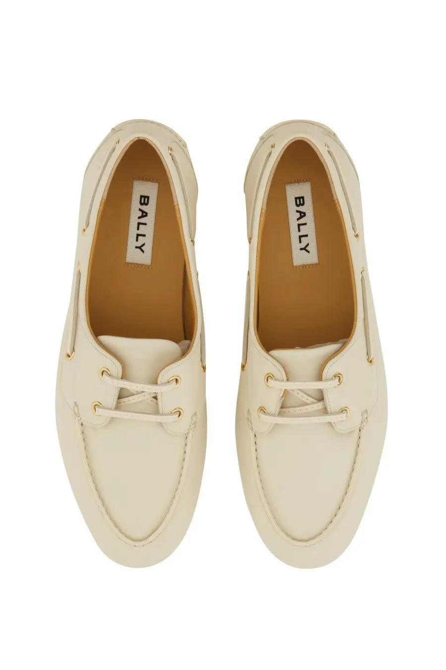 Bally women’s moccasin pathy white cream-colored boat shoes with white laces and gold-tone eyelets