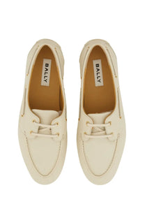 Bally women’s moccasin pathy white cream-colored boat shoes with white laces and gold-tone eyelets