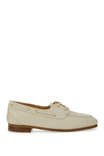 Bally women’s moccasin pathy white cream leather boat shoe with gold tone eyelets and brown rubber sole