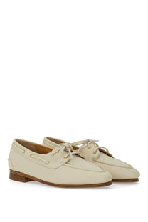 Bally women’s moccasin Pathy white cream-colored leather boat shoes with tan laces and gold-tone eyelets