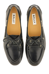 Bally women’s moccasin plume black leather loafers with gold-toned eyelets and laces in a classic design