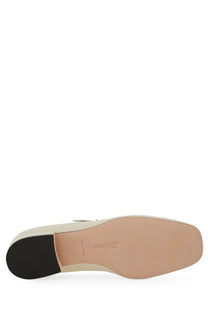 Cream-colored leather loafer pump for women by Bally with low block heel and minimalist design in white leather