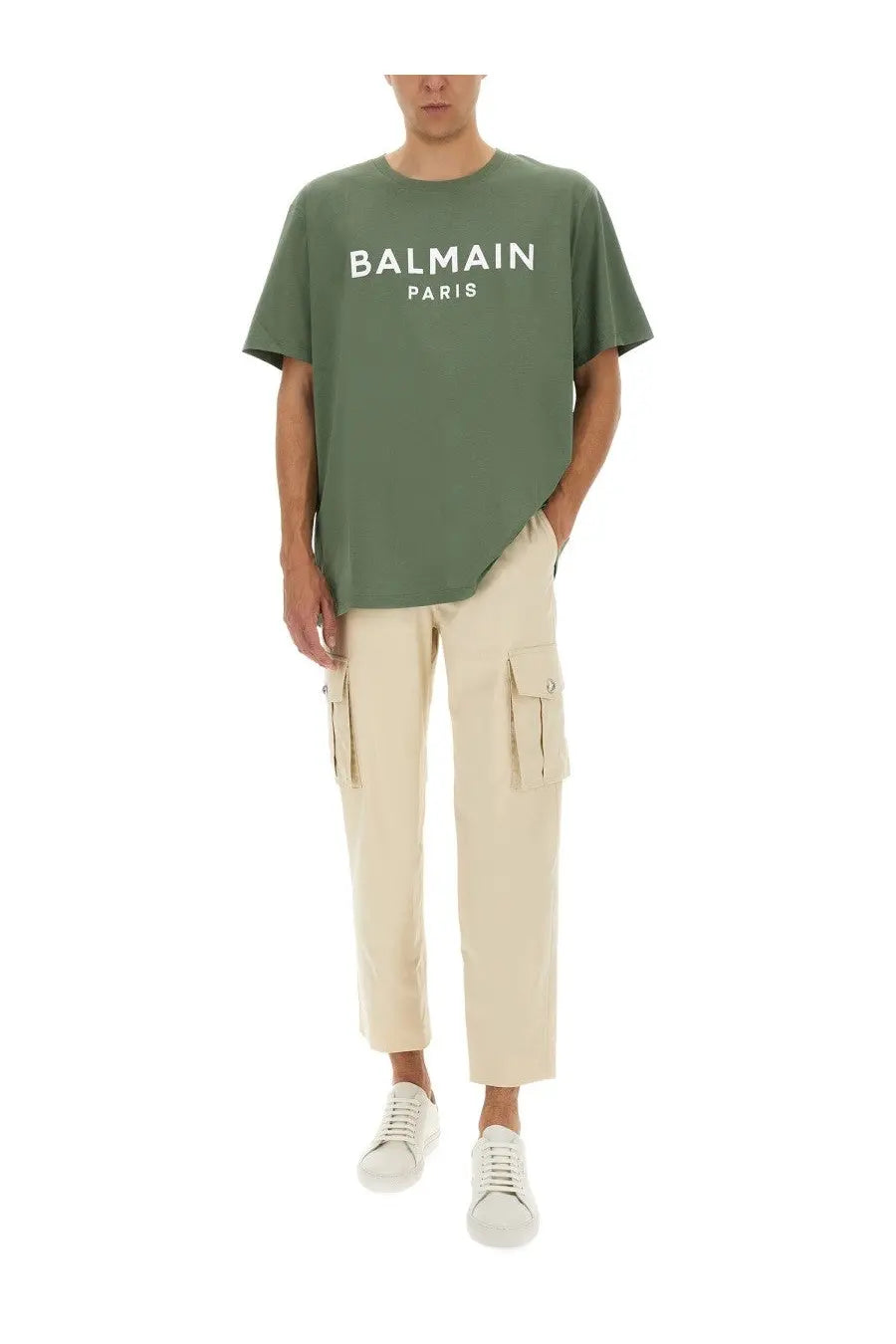 Olive green balmain paris cotton t-shirt with bold white lettering paired with beige men’s cotton cargo pants