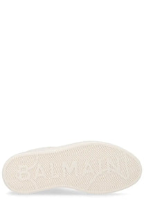 Balmain men’s court sneaker white with white rubber sole featuring embossed logo and herringbone tread pattern