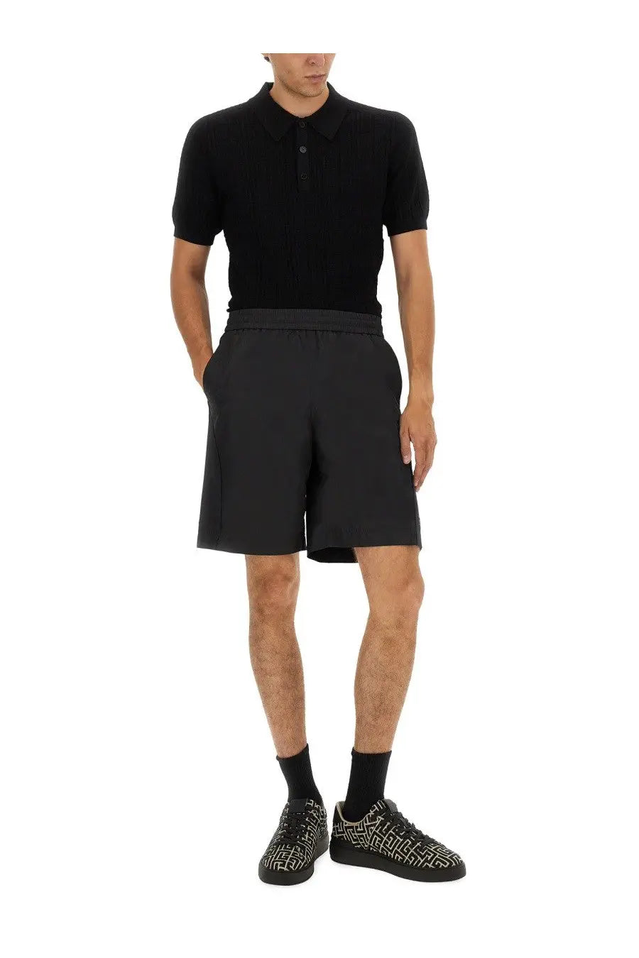 Balmain men’s knitted polo black short-sleeved shirt with classic collar and buttoned placket