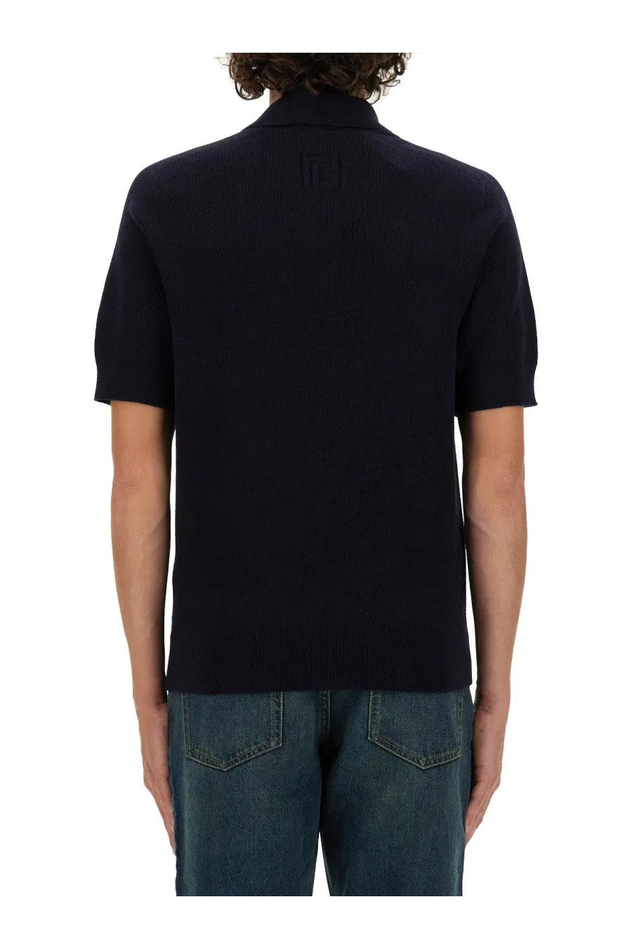 Black ribbed knit polo shirt with classic collar and short sleeves in merino wool by balmain mens blue edition
