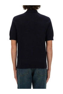 Black ribbed knit polo shirt with classic collar and short sleeves in merino wool by balmain mens blue edition