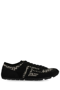 Balmain men’s racer sneaker in black suede with white and gray geometric pattern on side heel and tongue