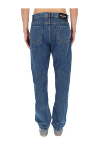 Blue denim balmain men’s straight jeans with black waistband label in white text showing back side