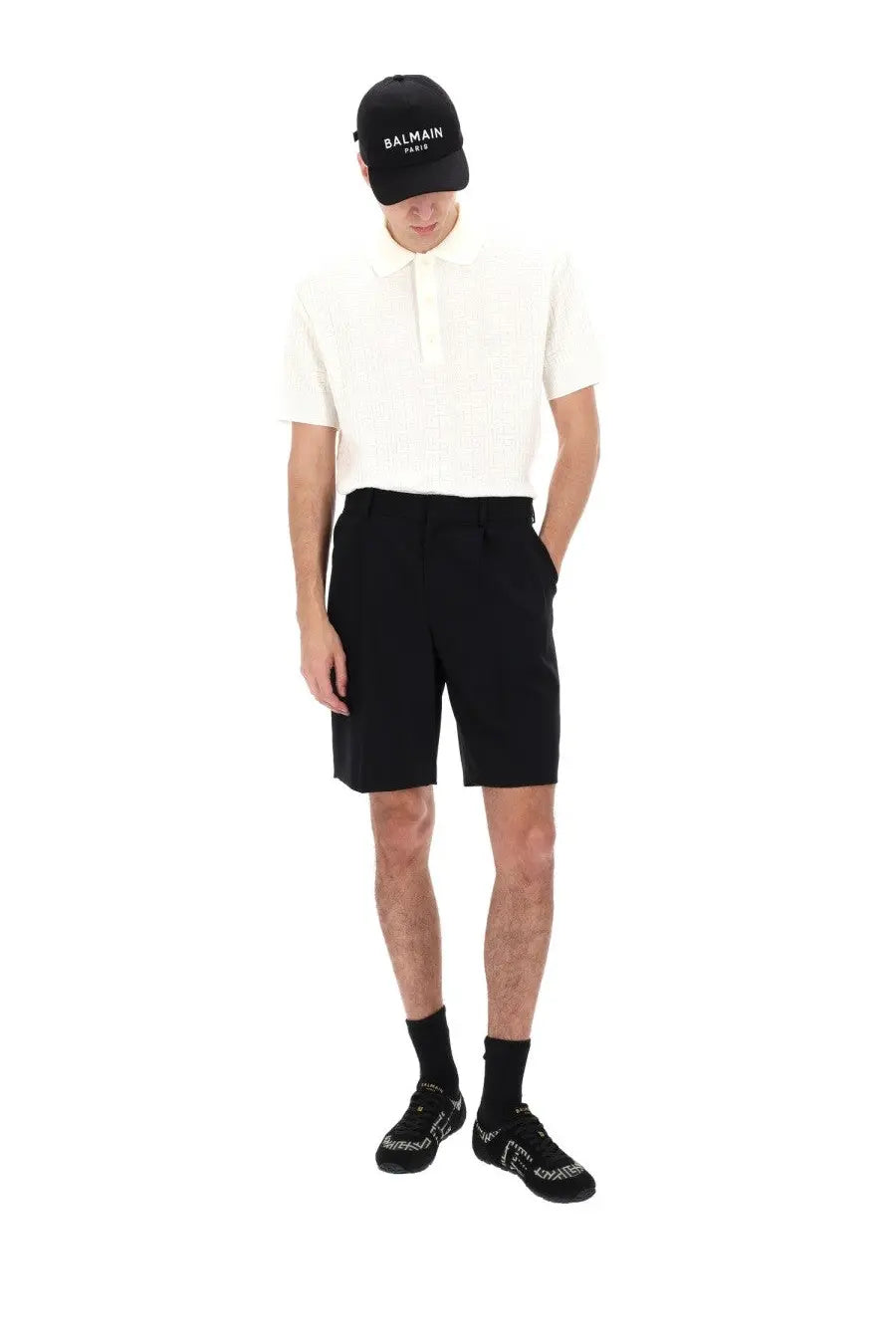 Black balmain paris cap with white embroidered logo paired with balmain men’s wool tailored shorts black