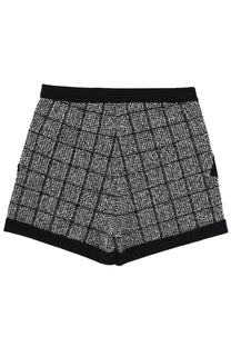 Balmain women’s cotton tweed shorts in black with silver checkered pattern and textured fabric with solid black waistband