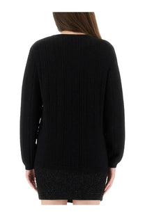 Balmain women’s black ribbed knit sweater with textured vertical stripes and long sleeves