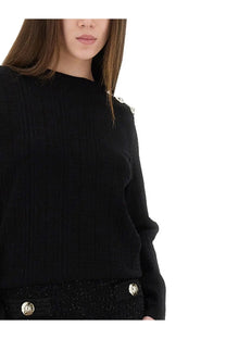 Balmain women’s black knitted long-sleeved top with metallic button accents and textured fabric