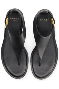 Balmain women’s sandal anthem black leather thong sandals with gold-tone metal accents and balmain paris logo insole