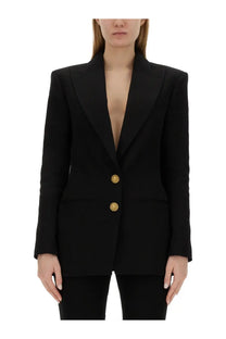 Balmain women’s single breasted black blazer with structured shoulders and gold toned buttons in refined fabric