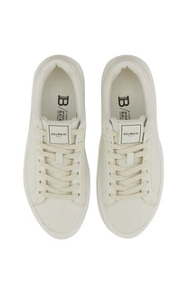 Pair of white balmain women’s sneaker court with clean minimalist design and subtle insole branding