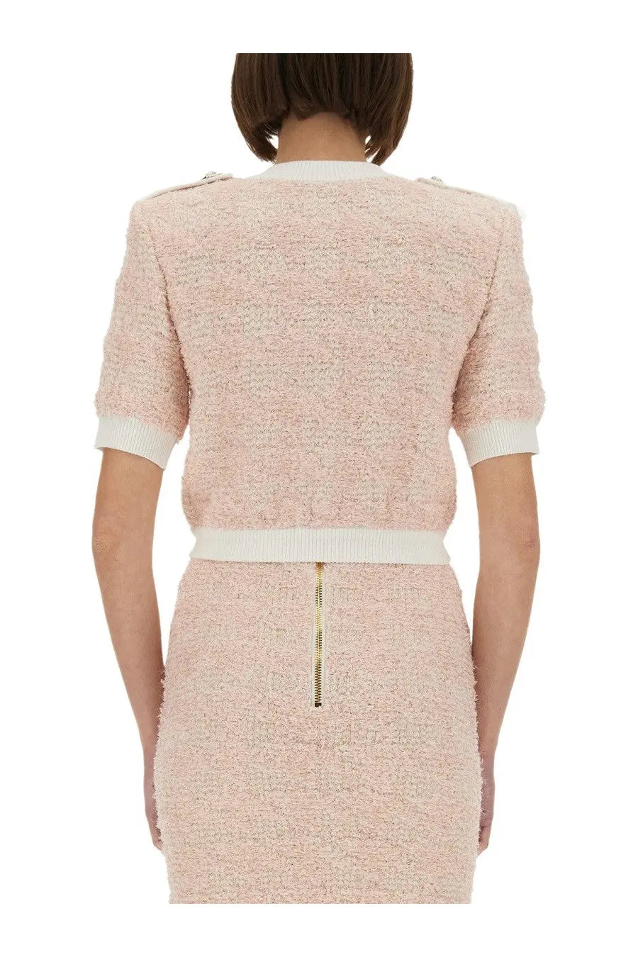 Balmain women’s soft pink tweed two-piece set with cropped jacket and skirt featuring white ribbed accents