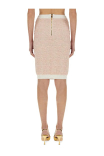 Balmain women’s tweed midi skirt blue showing the back side with blush pink textured knit pencil design and gold zipper