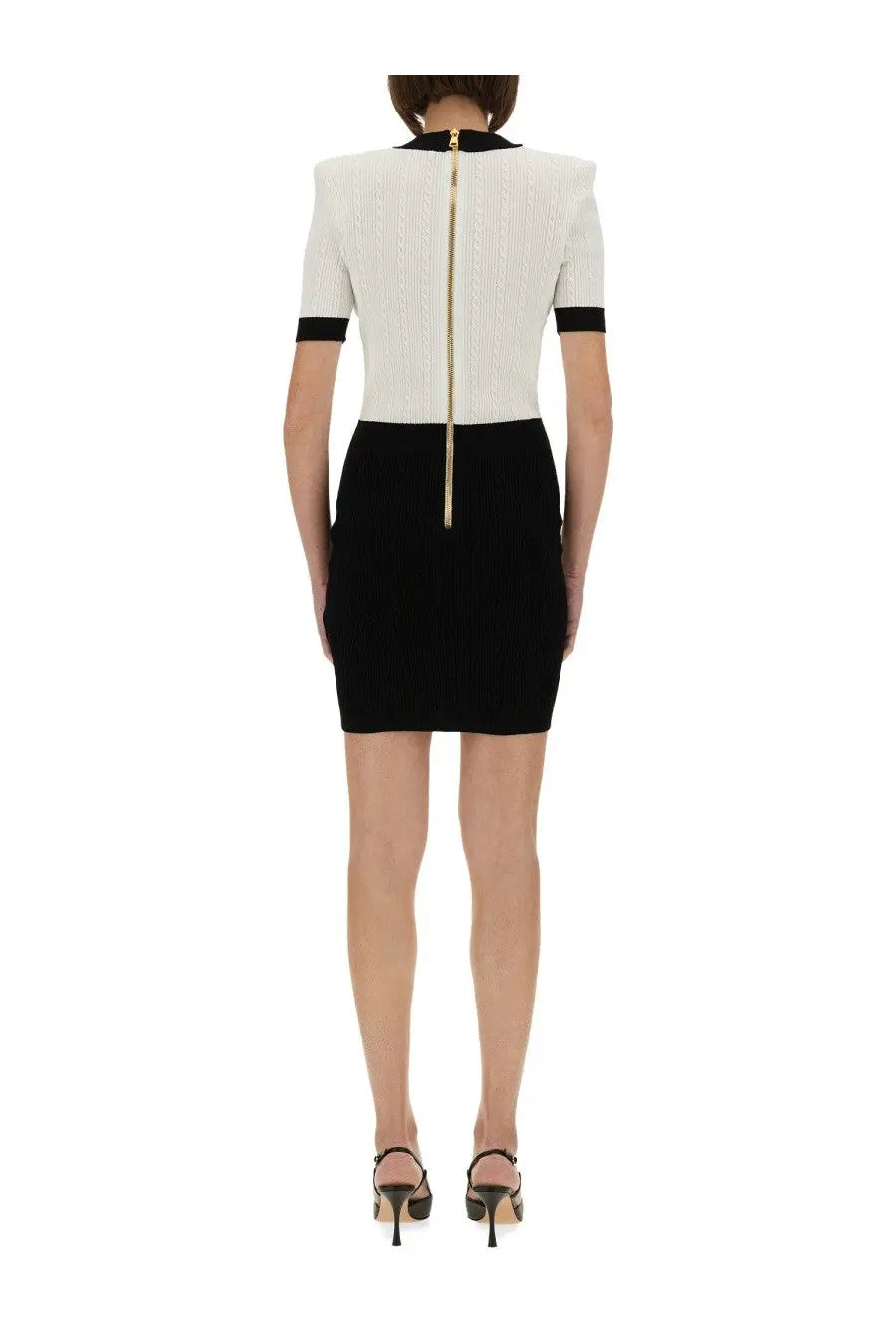 Balmain women’s two tone bodycon dress in black and white ribbed knit with gold zipper detail