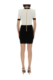 Balmain women’s two tone bodycon dress in black and white ribbed knit with gold zipper detail
