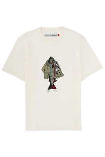 Cream-colored cotton t-shirt with fish illustration wearing beige trench coat and red plaid scarf paul smith for barbour branding