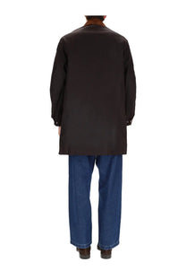 Black long-sleeved coat with classic collar and buttoned cuffs in barbour men’s waxed cotton jacket brown product image