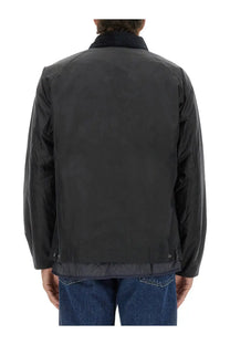 Barbour men’s black waxed cotton jacket with quilted hem and contrasting dark collar perfect for outdoor wear