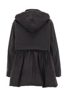Black hooded coat with flared skirt-like lower section from Barbour women’s Barbour Ganni coat brown collection