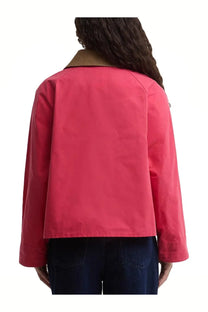 Barbour women’s Spey Paul Smith jacket in vibrant coral pink with tan collar made from smooth lightweight fabric