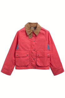 A vibrant coral-red barbour women’s spey paul smith jacket with a tan collar and blue patch accents on sleeves