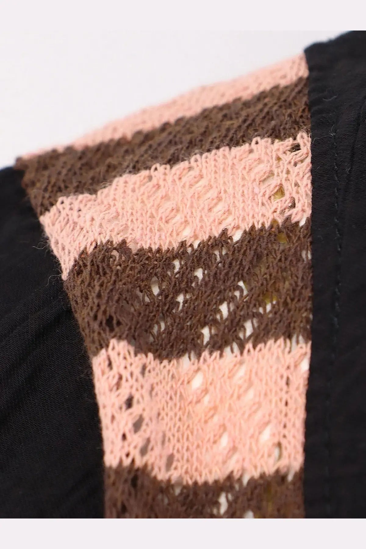 A delicate hand-knitted vest with alternating pink and brown lace stripes paired with barrow mens black viscose blend shirt