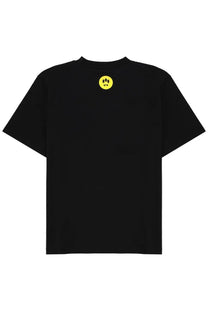 Black short-sleeved barrow unisex shirt con black with small yellow smiley face logo featuring three black dots and fangs on back