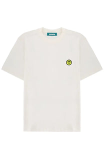 Off-white short-sleeved Barrow unisex shirt with small yellow smiley face patch and green brand tag at neckline