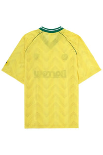 Barrow unisex yellow football jersey with subtle chevron pattern and green and white collar trim