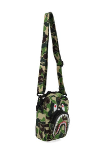 A bathing ape men’s borsa abc camo shark mini crossbody bag in green brown and black camouflage pattern