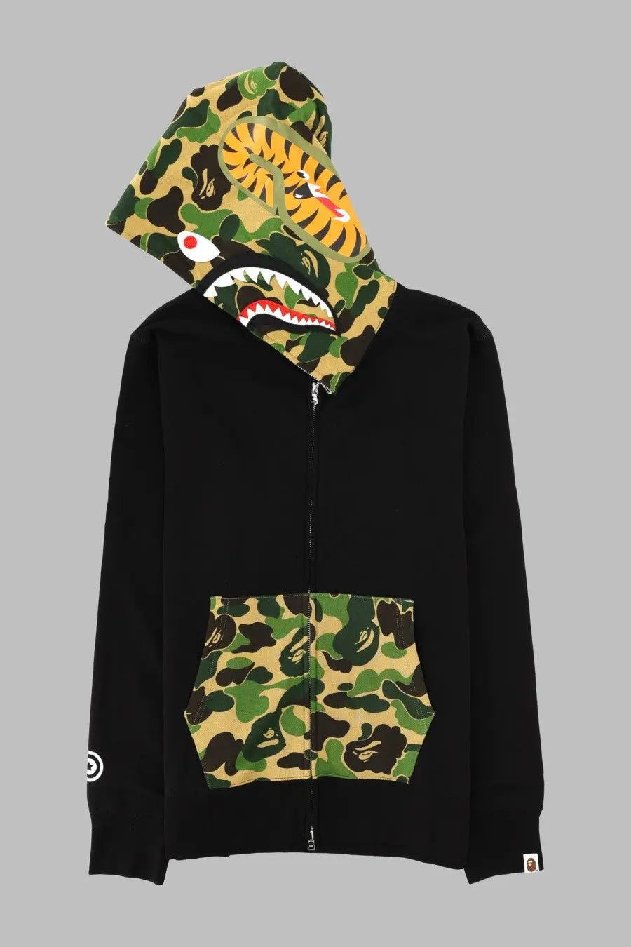 A bathing ape men’s black zip-up hoodie with camouflage hood and pocket featuring tiger face design