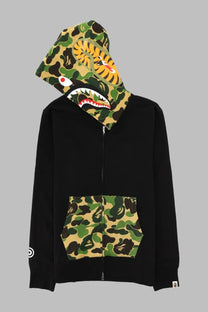 A bathing ape men’s black zip-up hoodie with camouflage hood and pocket featuring tiger face design