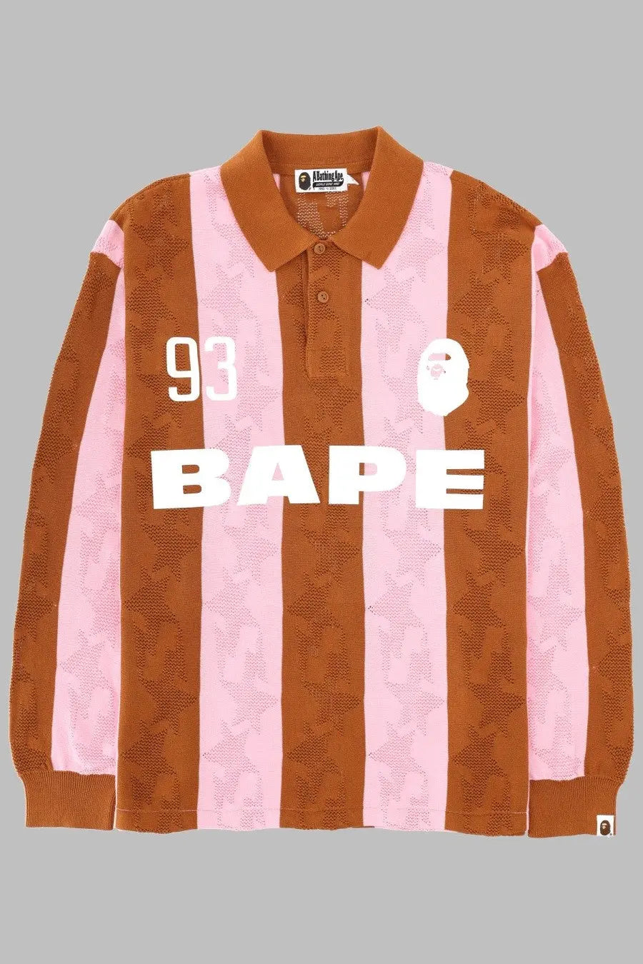 A bathing ape men’s polo in cotone jacquard multicolor featuring pink and brown stripes with a white bape logo