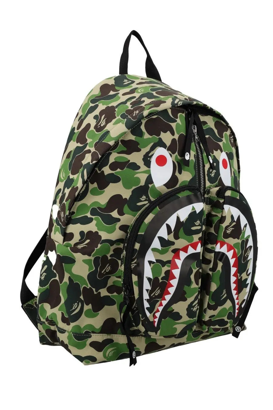 A bathing ape men’s green and brown camouflage backpack with a black white and red shark face design