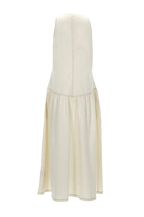 Cream-colored leather maxi skirt with fitted bodice and flared tiered hem by baum und pferdgarten women’s abito almina white